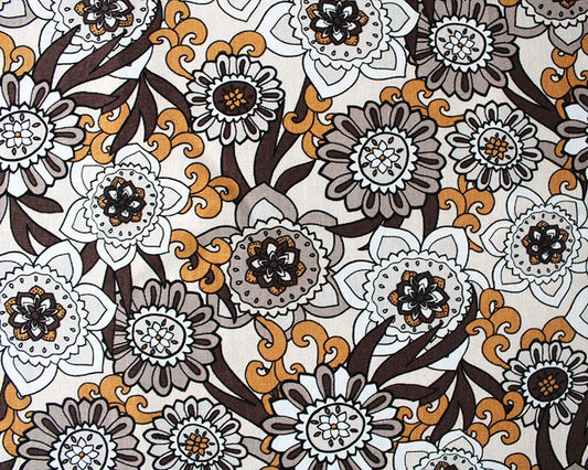 Patterned fabric with flowers and swirls in brown, orange, and white on a beige background